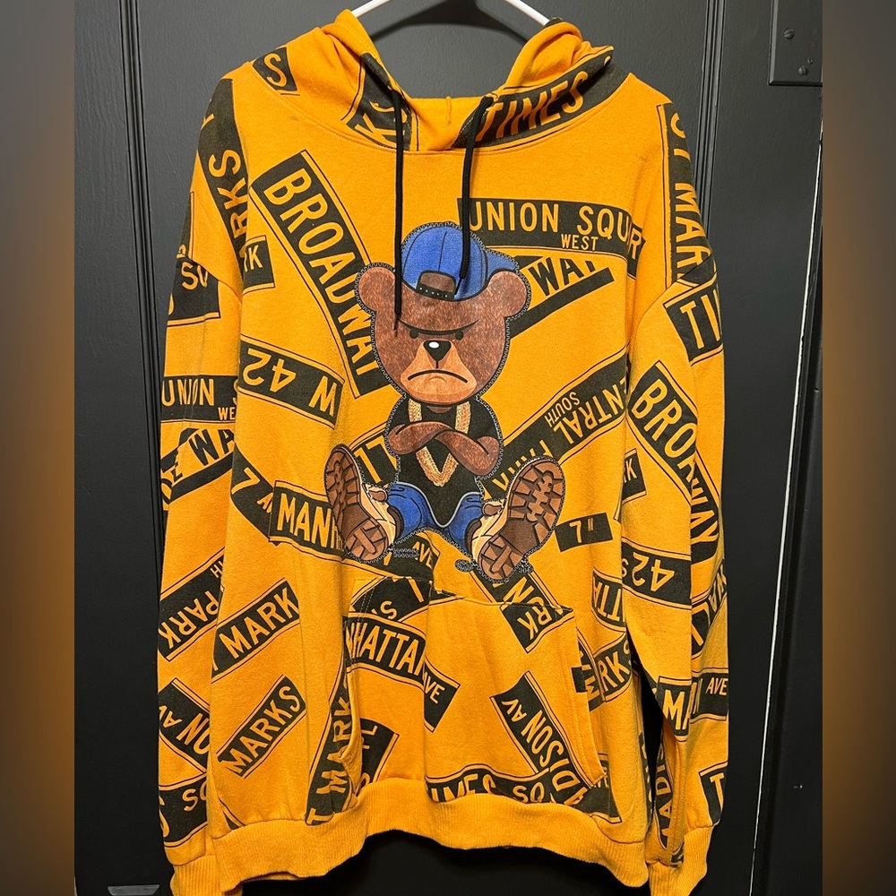 Bold Orange and Black Hoodie with Graphic Design